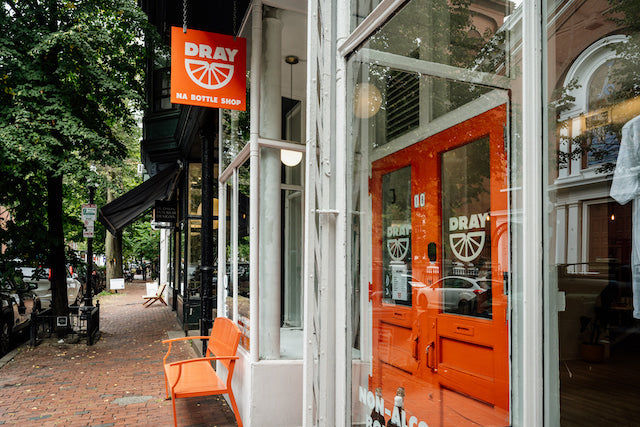 Exterior photo of Dray's orange store sign and storefront